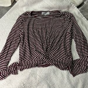 from marshall’s it’s size S has white and burgundy color lines.